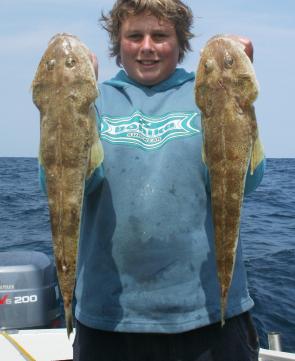 Brandon Cole took this pair of big sand flathead on squid baits fished in 40m of water.